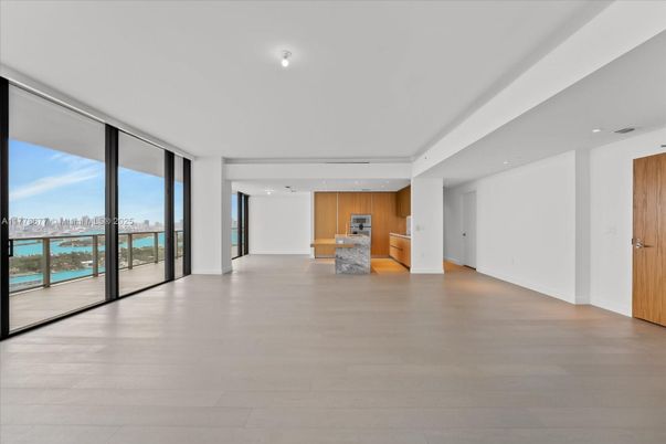 Empty room, Interior, Kitchen, Recessed Lighting, Stainless Steel Appliances, Water, Wood Texture Flooring