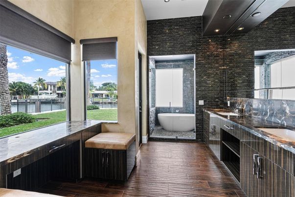 Bathroom, Dual Sink Vanities, Free Standing Baths, Interior, Recessed Lighting, Stone Walls, Wood Texture Flooring