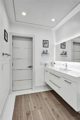 Bathroom, Dual Sink Vanities, Interior, Recessed Lighting, Wood Texture Flooring