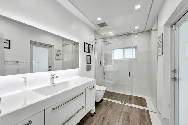 Bathroom, Dual Sink Vanities, Glass Shower, Interior, Recessed Lighting, Wood Texture Flooring