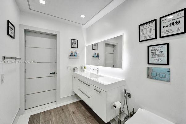 Bathroom, Dual Sink Vanities, Interior, Recessed Lighting, Wood Texture Flooring