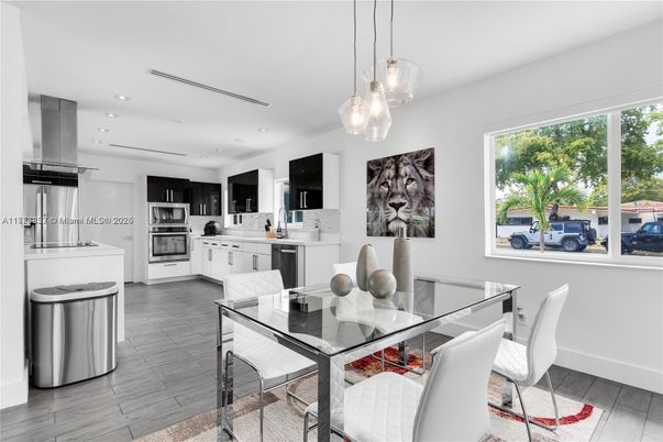 Dining room, Interior, Kitchen, Pendant Lights, Recessed Lighting, Stainless Steel Appliances, Wood Texture Flooring
