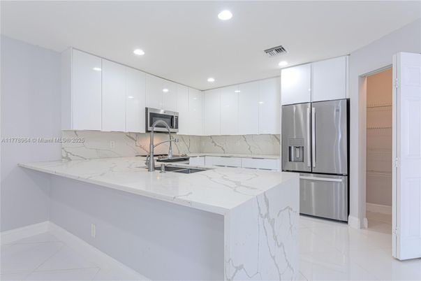 Interior, Kitchen, Marble, Marble Walls, Recessed Lighting, Stainless Steel Appliances