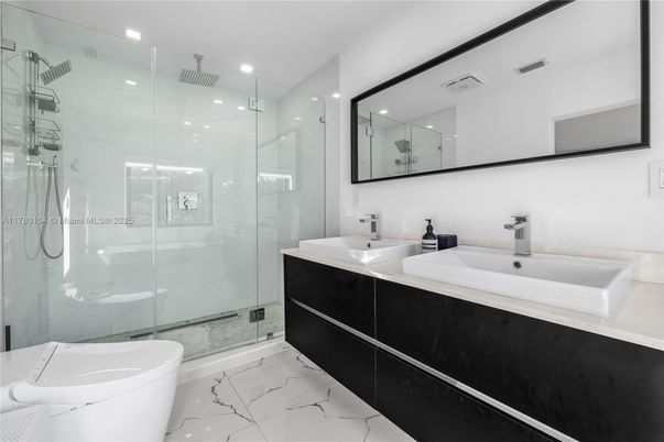 Bathroom, Dual Sink Vanities, Free Standing Baths, Glass Shower, Interior, Marble, Marble Walls, Recessed Lighting