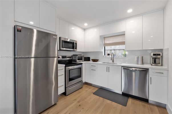 Interior, Kitchen, Recessed Lighting, Stainless Steel Appliances, Wood Texture Flooring