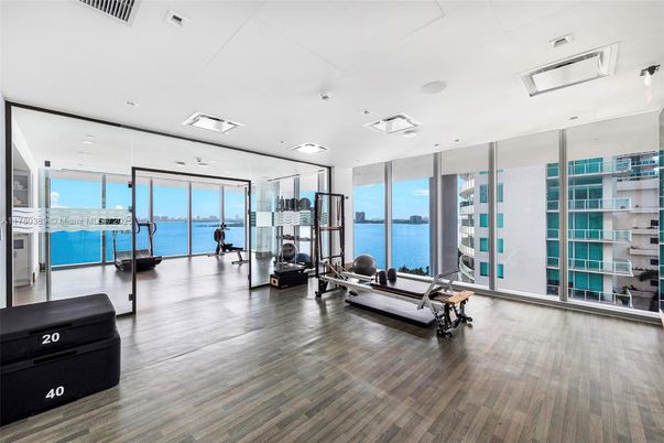 Fitness Equipment, Gym, Interior, Recessed Lighting, Water, Wood Texture Flooring