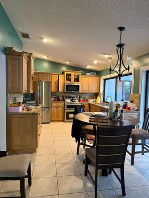 Chandelier, Dining room, Interior, Kitchen, Recessed Lighting, Stainless Steel Appliances