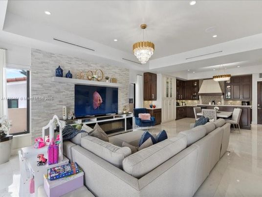 Chandelier, Dining room, Interior, Kitchen, Living room, Pendant Lights, Recessed Lighting, Stainless Steel Appliances, Stone Walls