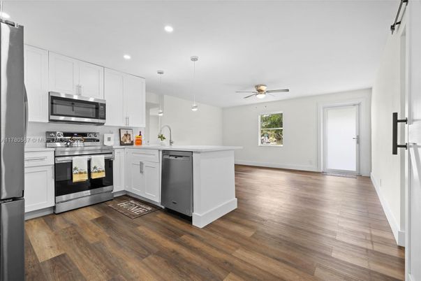 Interior, Kitchen, Pendant Lights, Recessed Lighting, Stainless Steel Appliances, Wood Texture Flooring