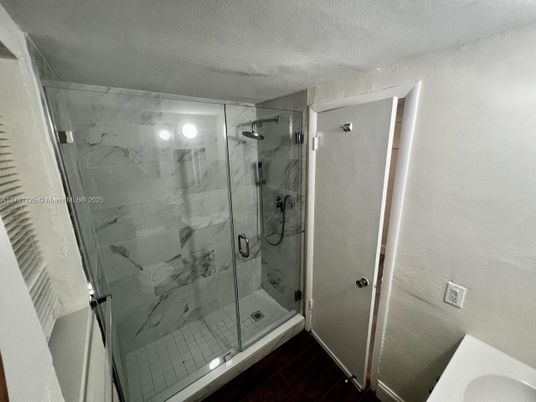 Bathroom, Glass Shower, Interior, Marble Walls, Wood Texture Flooring
