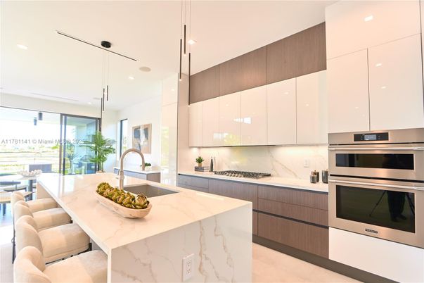 Interior, Kitchen, Marble Walls, Pendant Lights, Recessed Lighting, Stainless Steel Appliances