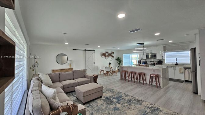 Dining room, Interior, Kitchen, Living room, Pendant Lights, Recessed Lighting, Stainless Steel Appliances, Wood Texture Flooring