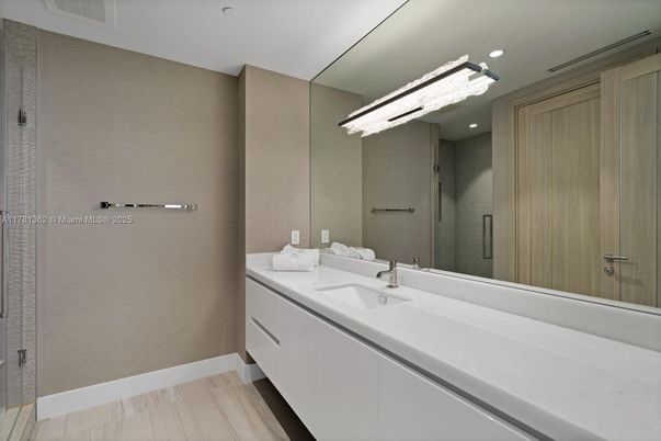 Bathroom, Dual Sink Vanities, Glass Shower, Interior, Recessed Lighting, Wood Texture Flooring