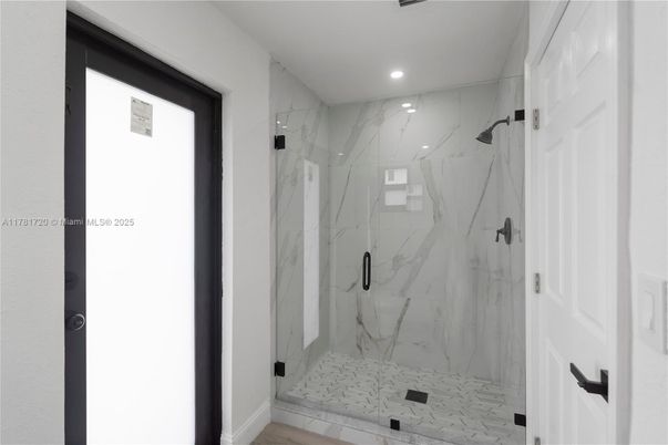 Bathroom, Glass Shower, Interior, Marble Walls, Recessed Lighting, Wood Texture Flooring
