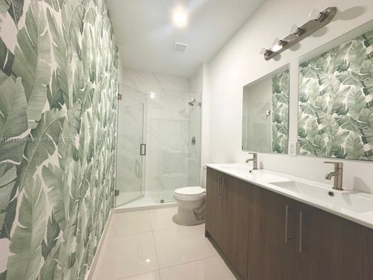 Bathroom, Dual Sink Vanities, Glass Shower, Interior, Marble Walls, Recessed Lighting
