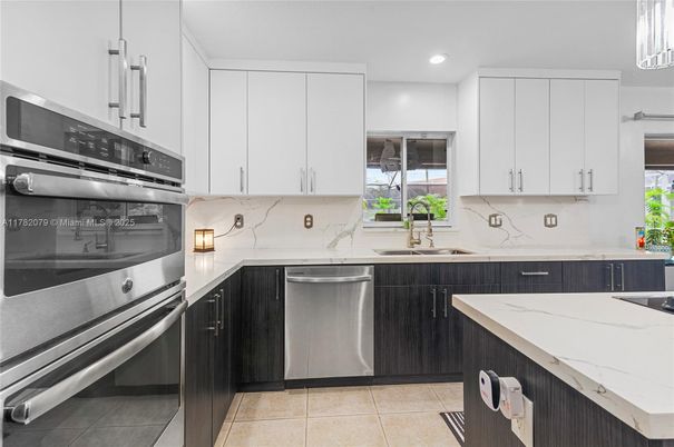 Interior, Kitchen, Marble Walls, Recessed Lighting, Stainless Steel Appliances