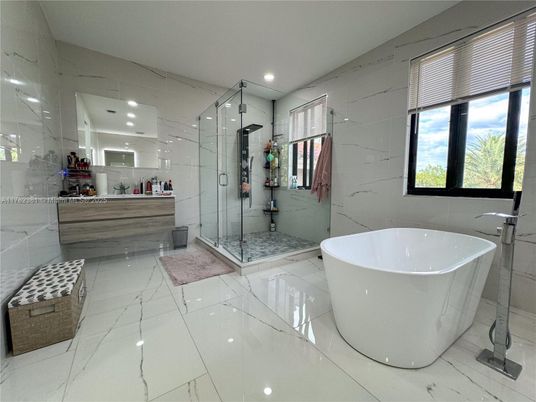 Bathroom, Free Standing Baths, Glass Shower, Interior, Marble, Marble Walls, Recessed Lighting