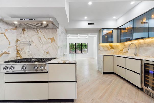 Interior, Kitchen, Marble Walls, Recessed Lighting, Stainless Steel Appliances, Wood Texture Flooring