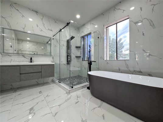 Bathroom, Free Standing Baths, Glass Shower, Interior, Marble, Marble Walls, Recessed Lighting