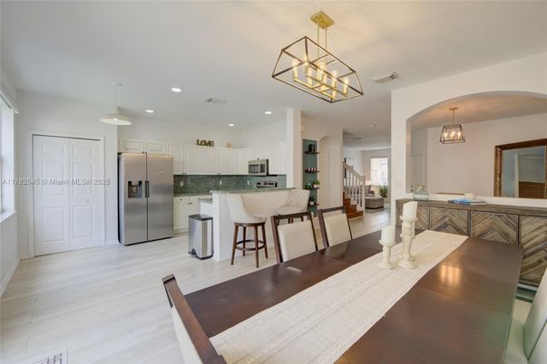Dining room, Interior, Kitchen, Pendant Lights, Recessed Lighting, Stainless Steel Appliances, Wood Texture Flooring