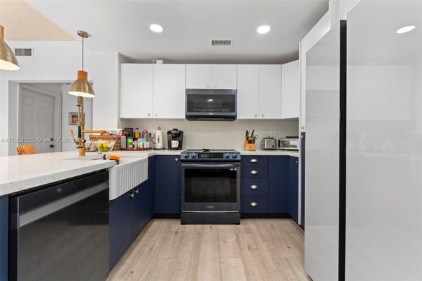 Interior, Kitchen, Pendant Lights, Recessed Lighting, Stainless Steel Appliances, Wood Texture Flooring