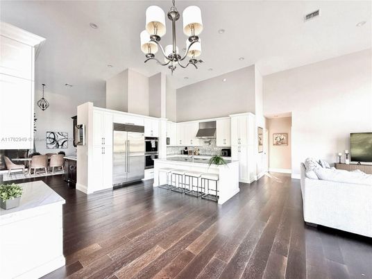Chandelier, Dining room, Interior, Kitchen, Recessed Lighting, Stainless Steel Appliances, Wood Texture Flooring