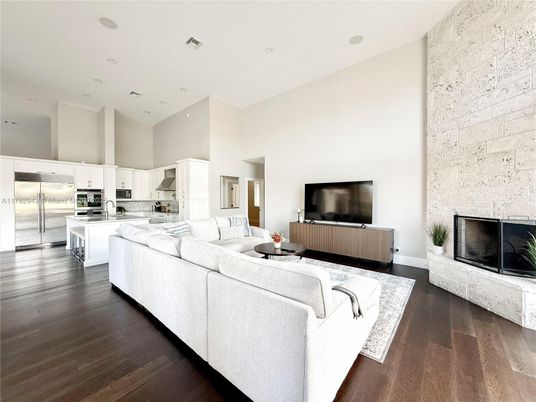 Fireplace, Interior, Kitchen, Living room, Recessed Lighting, Stainless Steel Appliances, Stone Walls, Wood Texture Flooring