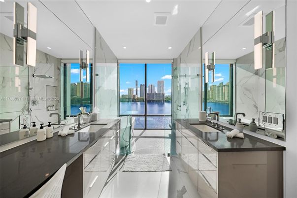 Bathroom, Dual Sink Vanities, Glass Shower, Interior, Marble Walls, Recessed Lighting, Water
