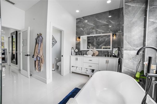 Bathroom, Dual Sink Vanities, Free Standing Baths, Interior, Marble Walls, Recessed Lighting