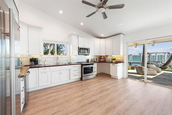 Interior, Kitchen, Recessed Lighting, Stainless Steel Appliances, Water, Wood Texture Flooring