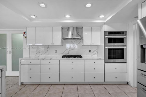 Interior, Kitchen, Marble Walls, Recessed Lighting, Stainless Steel Appliances