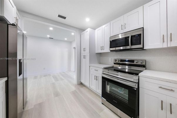 Interior, Kitchen, Recessed Lighting, Stainless Steel Appliances, Wood Texture Flooring