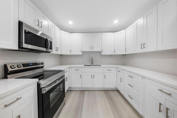 Interior, Kitchen, Recessed Lighting, Stainless Steel Appliances, Wood Texture Flooring