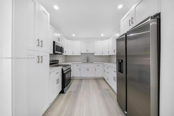 Interior, Kitchen, Recessed Lighting, Stainless Steel Appliances, Wood Texture Flooring