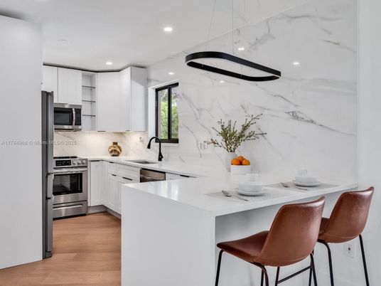 Interior, Kitchen, Marble Walls, Pendant Lights, Recessed Lighting, Stainless Steel Appliances, Wood Texture Flooring