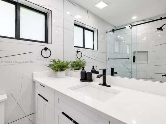 Bathroom, Dual Sink Vanities, Glass Shower, Interior, Marble Walls, Recessed Lighting