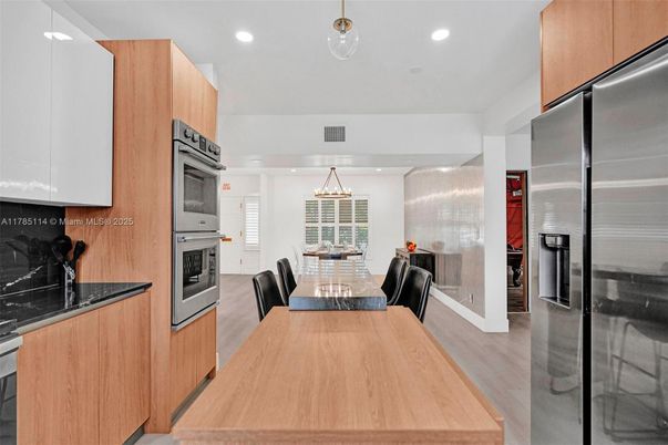 Dining room, Interior, Kitchen, Pendant Lights, Recessed Lighting, Stainless Steel Appliances, Wood Texture Flooring