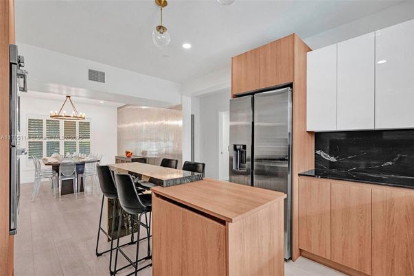 Dining room, Interior, Kitchen, Pendant Lights, Recessed Lighting, Stainless Steel Appliances, Wood Texture Flooring