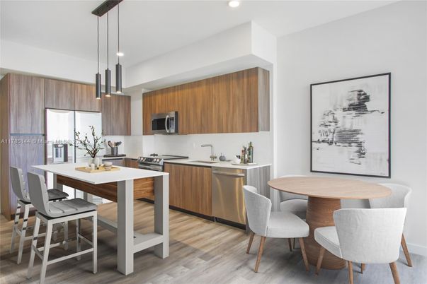 Dining room, Interior, Kitchen, Pendant Lights, Recessed Lighting, Stainless Steel Appliances, Wood Texture Flooring
