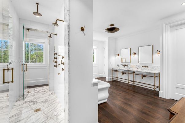 Bathroom, Dual Sink Vanities, Glass Shower, Interior, Marble, Marble Walls, Recessed Lighting, Wood Texture Flooring