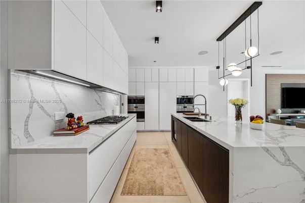 Interior, Kitchen, Marble Walls, Pendant Lights, Recessed Lighting, Stainless Steel Appliances