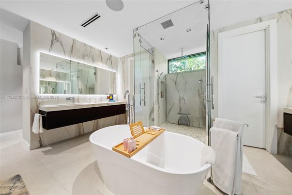 Bathroom, Dual Sink Vanities, Free Standing Baths, Glass Shower, Interior, Marble Walls, Recessed Lighting