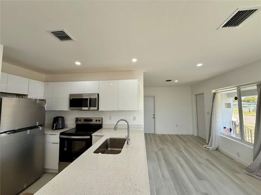 Interior, Kitchen, Recessed Lighting, Stainless Steel Appliances, Wood Texture Flooring