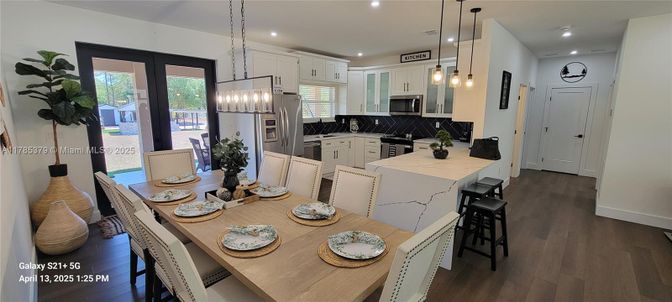 Dining room, Interior, Kitchen, Pendant Lights, Recessed Lighting, Stainless Steel Appliances, Wood Texture Flooring