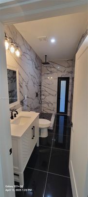 Bathroom, Dual Sink Vanities, Interior, Marble Walls, Recessed Lighting