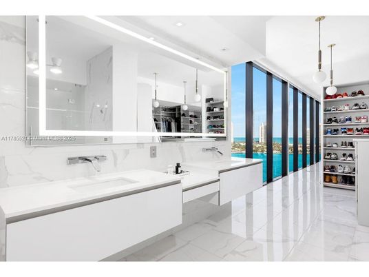 Bathroom, Dual Sink Vanities, Interior, Marble, Marble Walls, Pendant Lights, Recessed Lighting