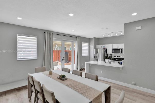 Dining room, Interior, Kitchen, Recessed Lighting, Stainless Steel Appliances, Wood Texture Flooring