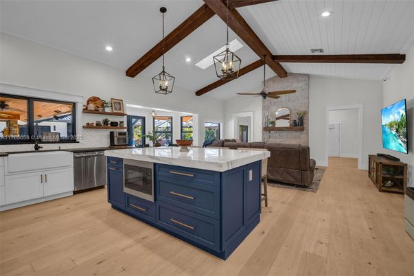 Fireplace, Interior, Kitchen, Pendant Lights, Recessed Lighting, Stainless Steel Appliances, Wooden Beams, Wood Texture Flooring