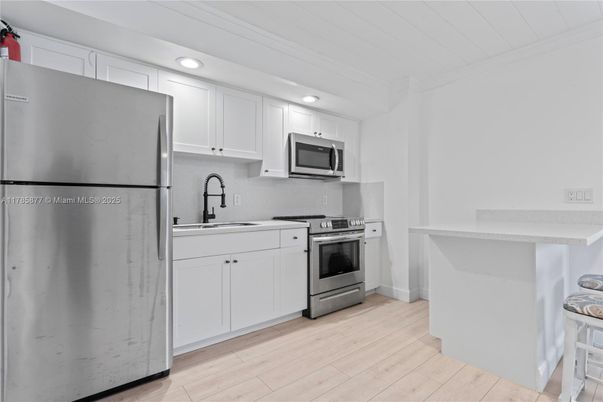 Interior, Kitchen, Recessed Lighting, Stainless Steel Appliances, Wood Texture Flooring