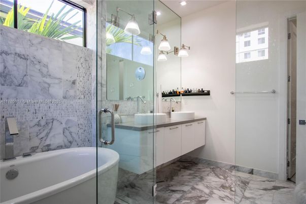 Bathroom, Dual Sink Vanities, Free Standing Baths, Glass Shower, Interior, Marble, Marble Walls, Pendant Lights, Recessed Lighting